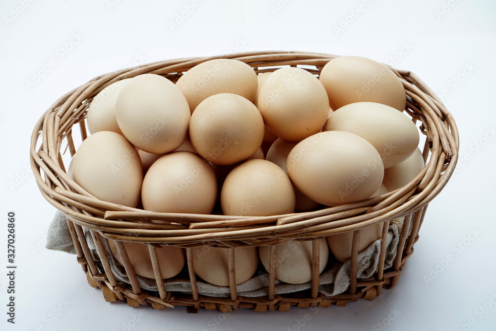 Basket with eggs isolated on a light background Basket with eggs isolated on a light background