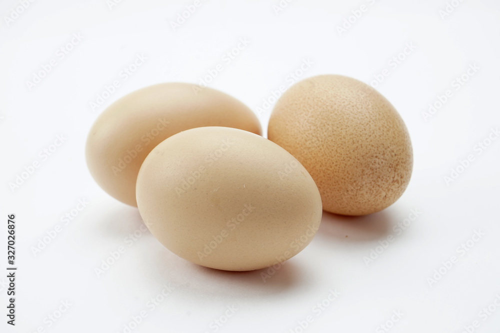 Chicken eggs isolated on a light background Chicken eggs isolated on a light background