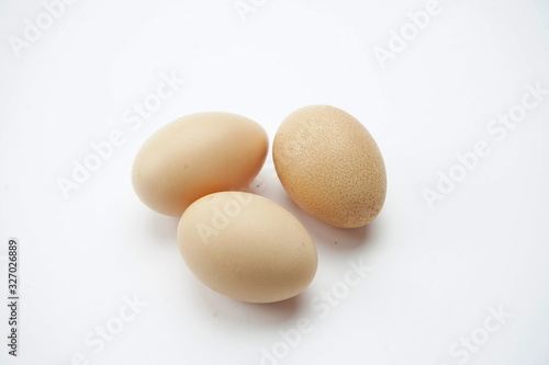 Chicken eggs isolated on a light background