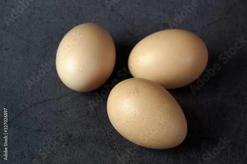 Chicken eggs on a dark background