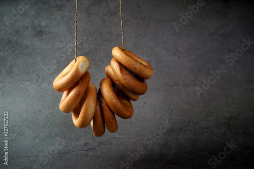 A bunch of baked bagels on a rope
