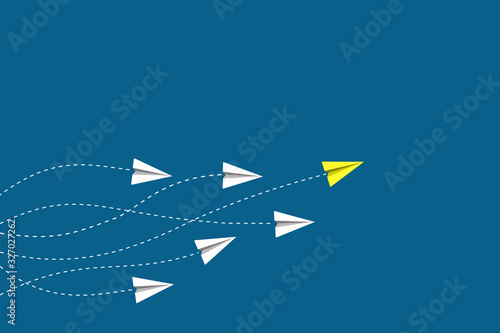 Leadership and competition concept, with yellow paper plane leading among white on blue background.