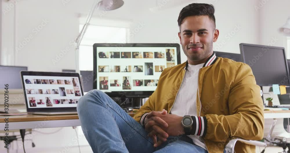 Front view of mixed race man in creative office Front view of mixed race man in creative office
