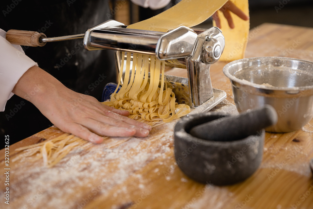 Photography Caucasian chef making pasta