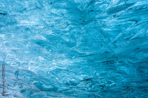 Ice pattern with waves from the Vatnajökull glacier ice cave © Vadim