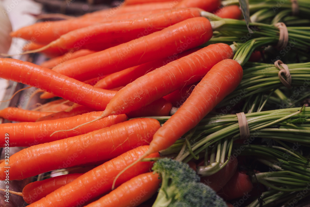 Stock photo of a close-up of a bunch of carrots at a market stall Stock photo of a close-up of a bunch of carrots at a market stall