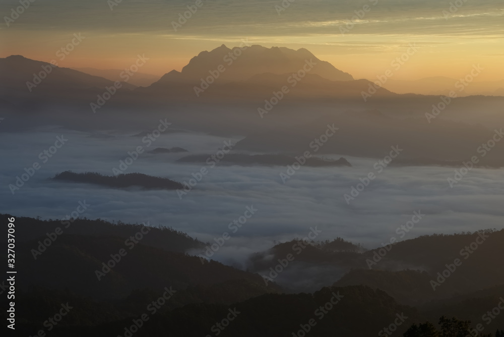 Beautiful sea of fog in a valley with orange sky cloud in a sunrise time