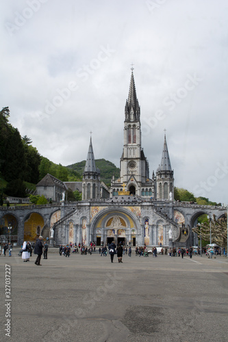 LOURDES,FRANCE-1 -MAY -2017: Procession at Marie Grotto at the Cathedral of of Our Lady of the Rosary in Lourdes, France.