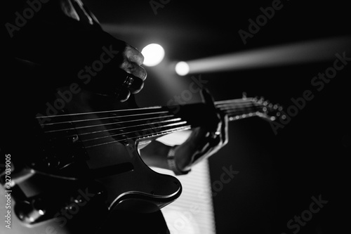 Canvas Print Closeup of a guitarist performing live