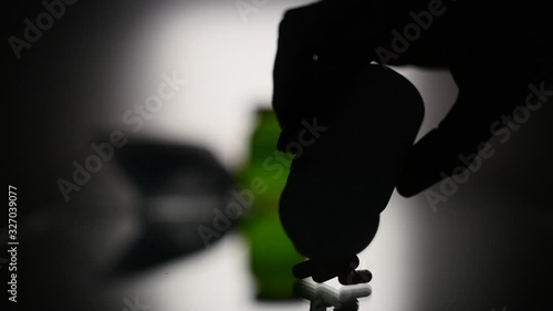 Wallpaper Mural Hand pours the pills on the table in slow motion Torontodigital.ca