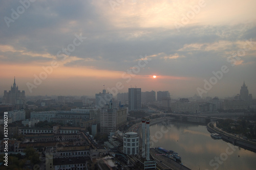 Pink sunrise over the hazy city of Moscow