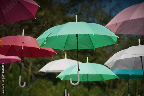 Perspective of colorful umbrella set in a park