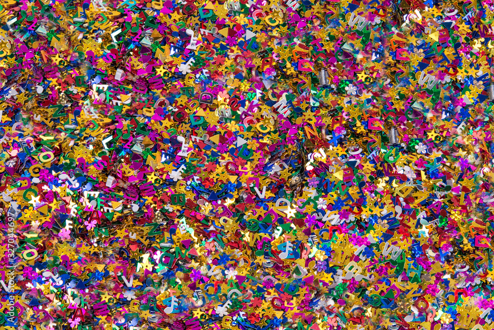 Fototapeta premium Confetti close up, various colors and shapes of metallic confetti, horizontal background