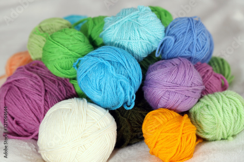 multi-colored bright balls of thread for knitting or crocheting