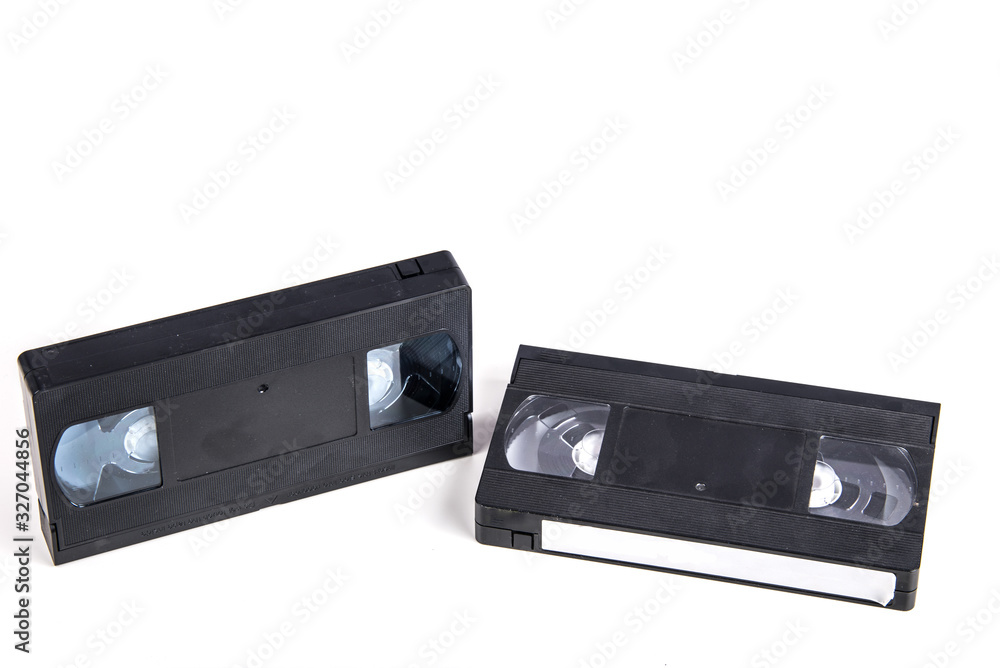 VHS video cassette isolated on white, retro video technology , analog magnetic tape 