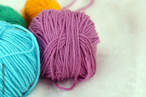 multi-colored bright balls of thread for knitting or crocheting