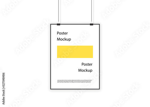 Paper poster hanging on ropes and binders