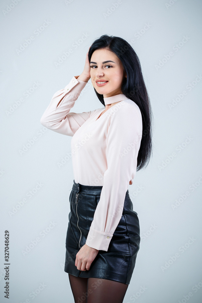 Beautiful girl in white blouse and black leather skirt Beautiful girl in white blouse and black leather skirt