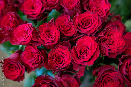 Beautiful bouquet of red roses made with love in the greek flowers boutique - preparation for Valentine s Day.