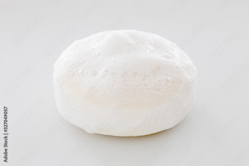 closeup white soap with foam on white background closeup white soap with foam on white background