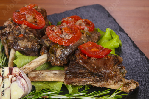 Baked elk meat with tomatoes