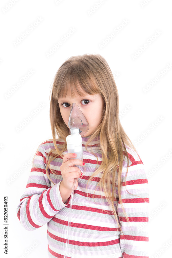 Baby girl with asthma problems making inhalation with mask on her face. Aerosol treatment of respiratory diseases. Baby girl with asthma problems making inhalation with mask on her face. Aerosol treatment of respiratory diseases.