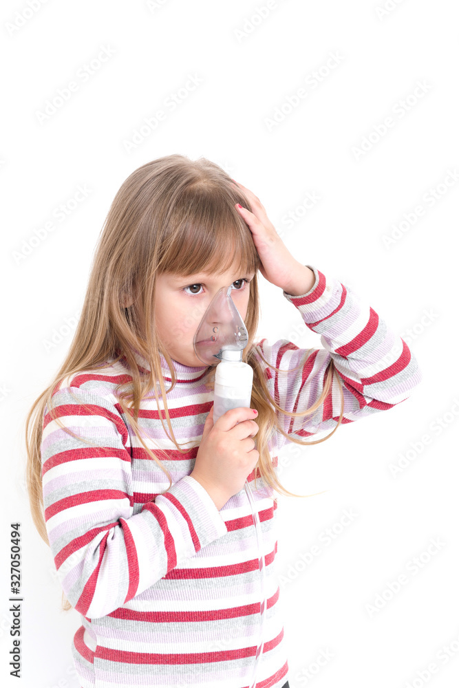 Baby girl with asthma problems making inhalation with mask on her face. Aerosol treatment of respiratory diseases. Baby girl with asthma problems making inhalation with mask on her face. Aerosol treatment of respiratory diseases.