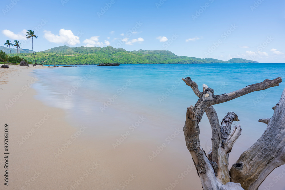 A view of exotic beach with sea, sand and blue sky,during the day on a public beach in Rincon Beach,Samana peninsula, Dominican Republic