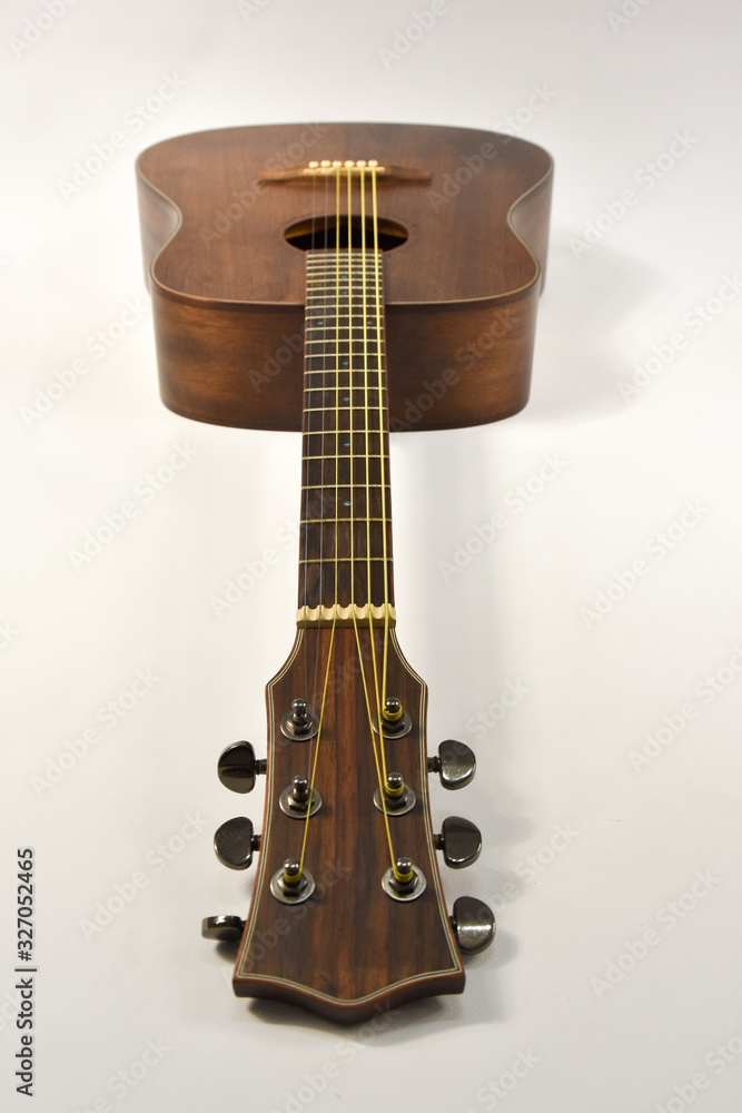 acoustic six-string guitar on a white background acoustic six-string guitar on a white background