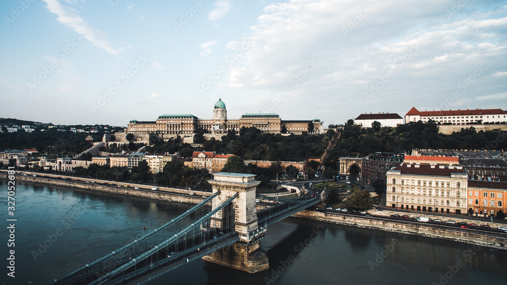 Aerial view of Buda Castle with Szechenyi Chain Bridge, Clark Adam Square. Buda Castle Royal Palace and Buda Tunnel at sunrise on a summer morning