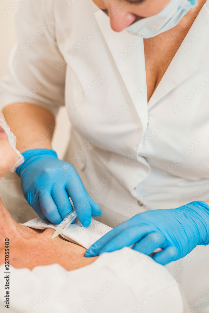Fototapeta premium The procedure of skin revitalization and the creation of a hydraulic reserve involves the use of preparations based on stabilized hyaluronic acid