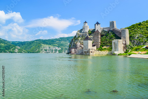 The old medieval Golubac Fortress that is being restored, located on the banks of the Danube River, near the famous Iron Gate or Djerdap Gorge in Djerdap National Park. Serbia. photo