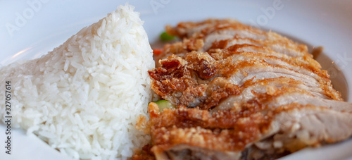 traditional asian food with crispy duck and sweet sour sauce