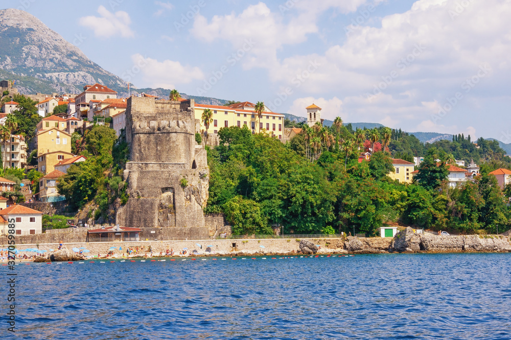 Beautiful summer Mediterranean landscape. Montenegro, Adriatic Sea. View of  Old Town of Herceg Novi from sea.  Bell tower of Saint Jerome Church. Sea Fortress (Forte Mare)