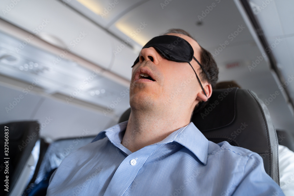 Man With Sleep Mask On Airplane Man With Sleep Mask On Airplane