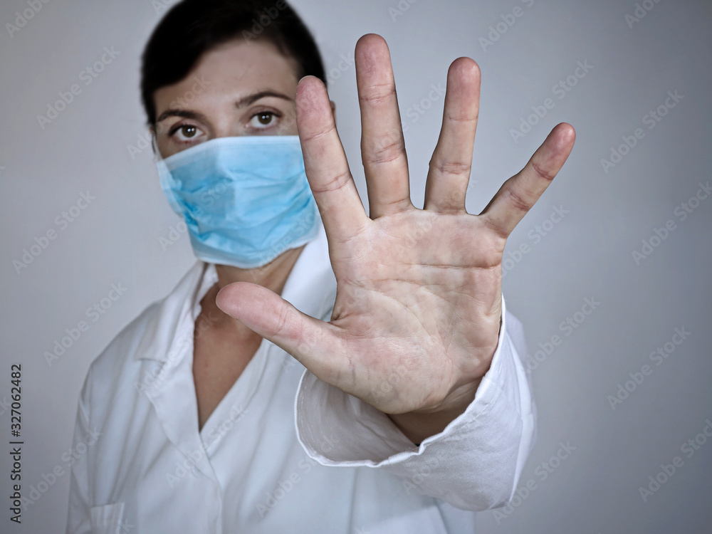 woman with face mask isolated on grey background woman with face mask isolated on grey background