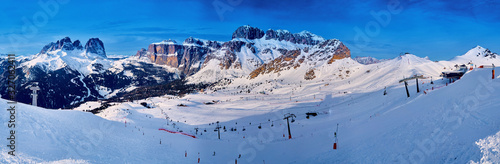 Beautiful panoramic view to the Sellaronda - the largest ski carousel in Europe - skiing the four most famous passes in the Dolomites (Italy), extraordinary snowy peaks of the dolomites, southern alps photo