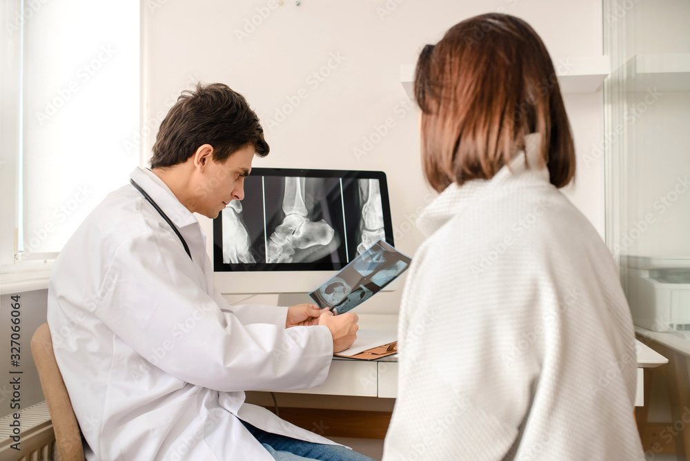 Young man doctor explain to the woman patient Young man doctor explain to the woman patient