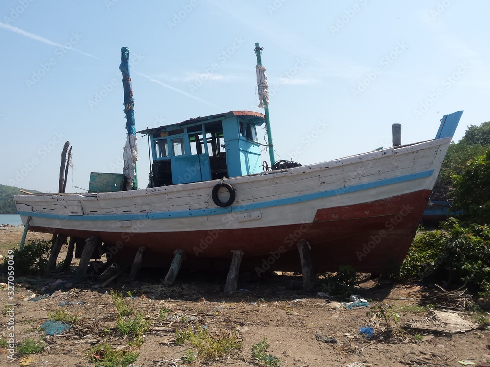 old fishing boat on the beach old fishing boat on the beach