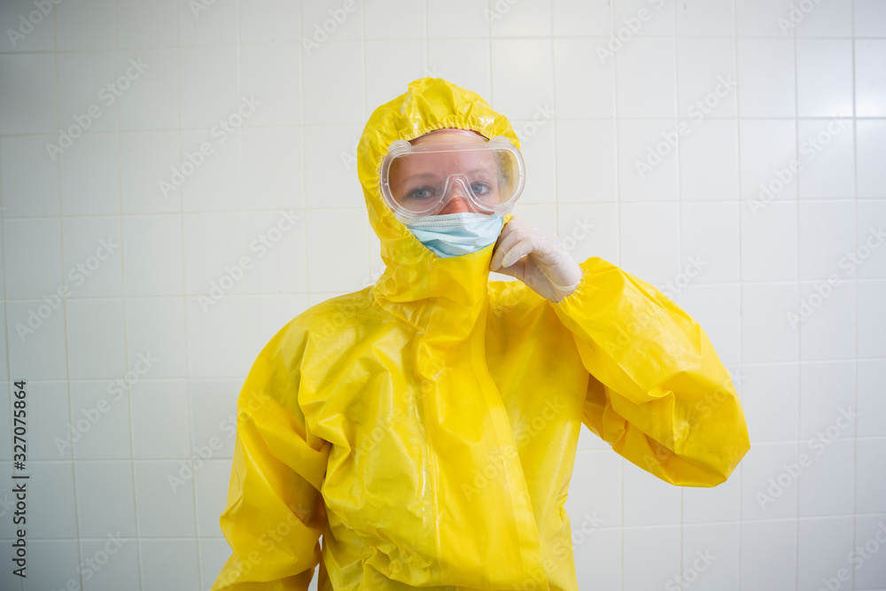 Woman in a yellow full protected suit Woman in a yellow full protected suit