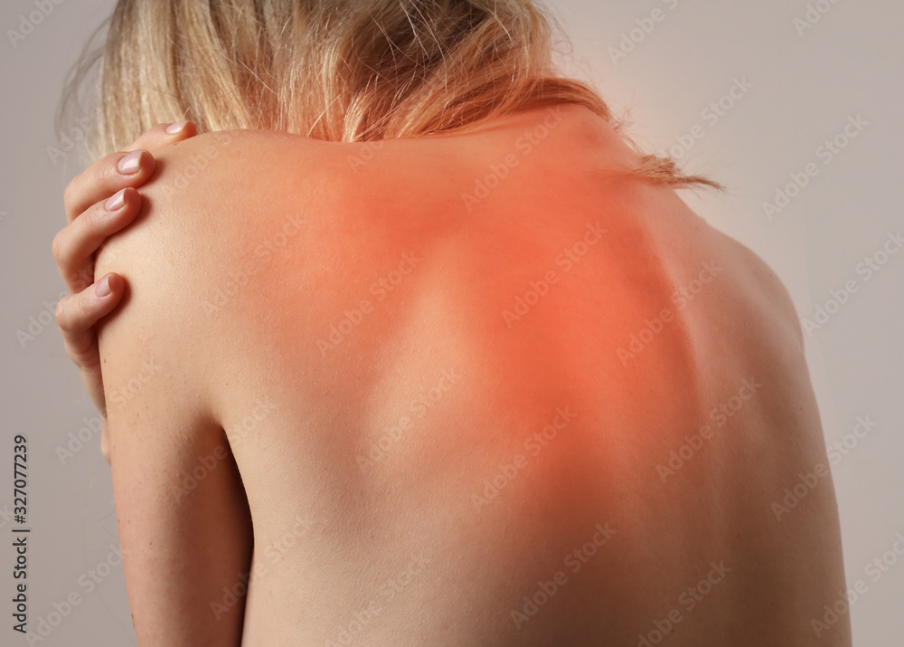 Woman suffering from back and neck pain. Chiropractic, Physiotherapy concept Woman suffering from back and neck pain. Chiropractic, Physiotherapy concept