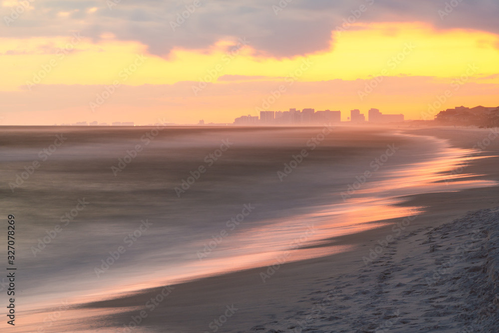 Long exposure pastel light twilight sunset in Santa Rosa Beach with Pensacola coast in Florida Panhandle at Gulf of Mexico ocean waves