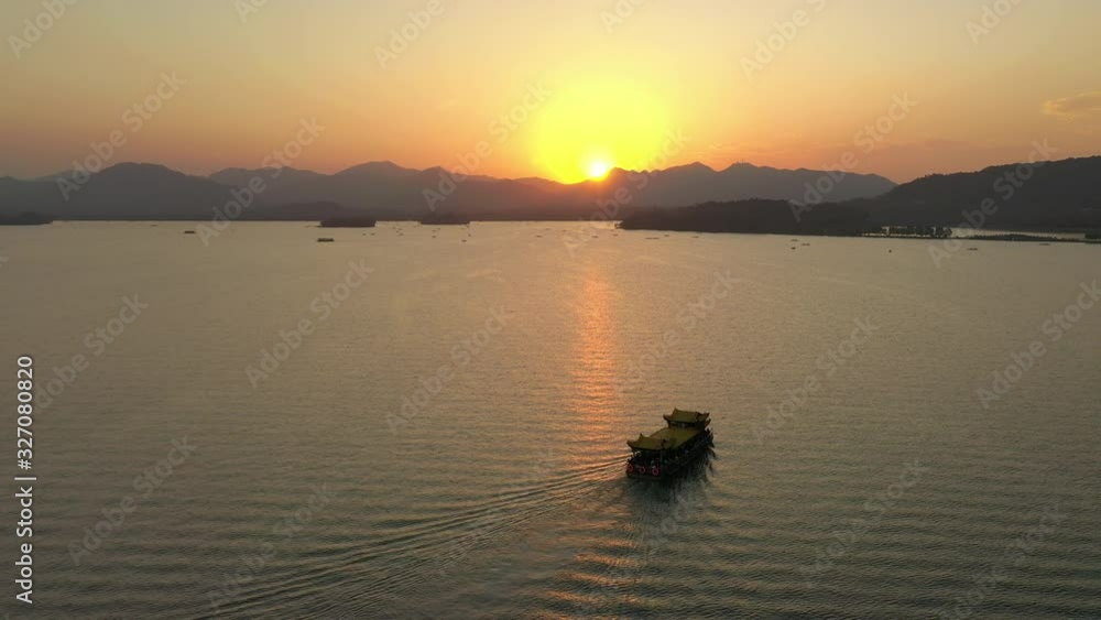 hangzhou city sunset time flight over famous lake tourist water traffic aerial panorama 4k china hangzhou city sunset time flight over famous lake tourist water traffic aerial panorama 4k china