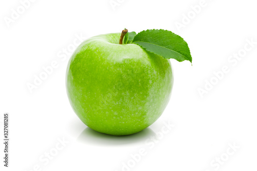 Ripe green apple with leaf on a white background .