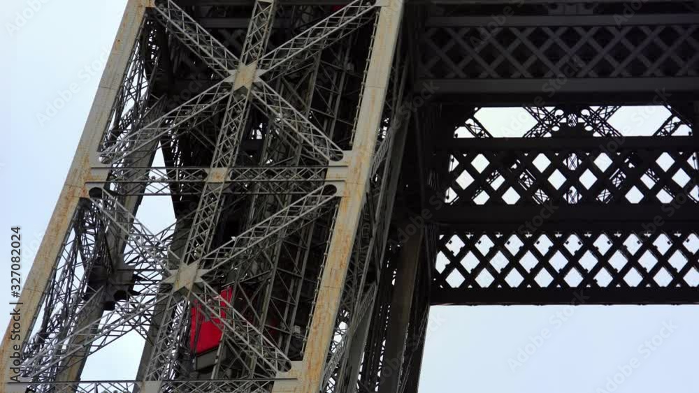 Elevator lift in Eiffel tower in Paris. Famous landmark in France. Popular European travel city & honeymoon destination. Elevator lift in Eiffel tower in Paris. Famous landmark in France. Popular European travel city & honeymoon destination.
