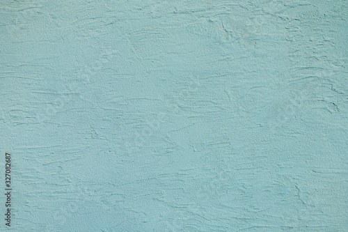こて跡の残る青い壁の背景テクスチャー photo