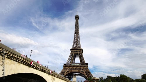 Eiffel tower seen from under the bridge. Famous travel landmark in Paris. Popular European city & honeymoon destination.  photo