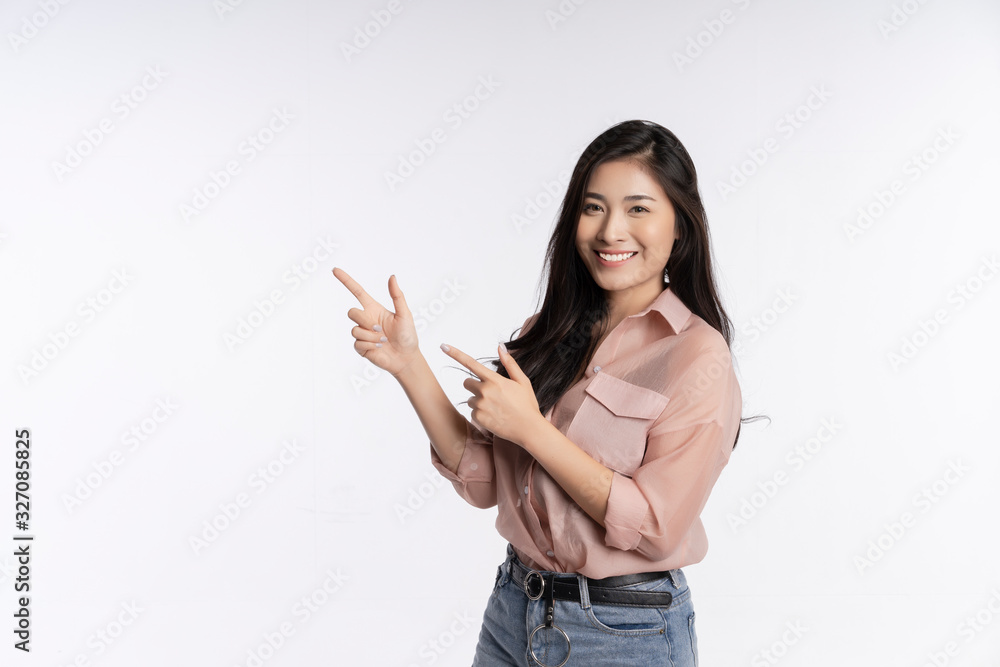 Beauty Asian woman smiles with a charming and shows something to you with healthy skin, teeth and hair isolated on white background, The lady in a summer t-shirt Short jeans. Copy space Beauty Asian woman smiles with a charming and shows something to you with healthy skin, teeth and hair isolated on white background, The lady in a summer t-shirt Short jeans. Copy space
