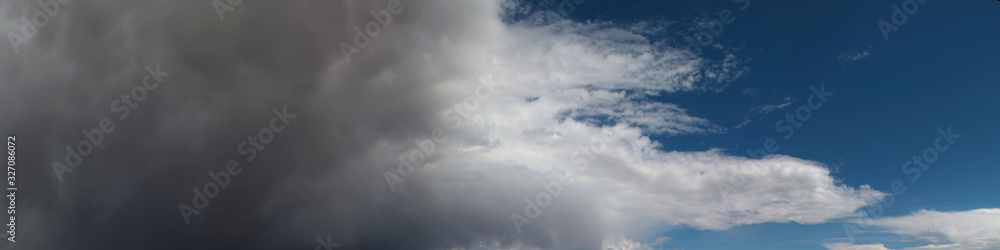 A thundercloud is approaching, panoramic image