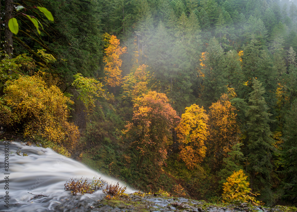 Long exposure of top of a  waterfall at Silver Falls State Park in Silverton, Oregon, USA, in the Autumn